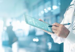 Medicine doctor and stethoscope touching icon medical network connection with modern interface on digital tablet in hospital background. Medical technology network concept