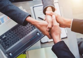 Concept of partnership - handshake business partners Successful team leader entrepreneurship .